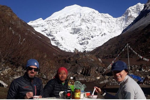 Trekkers beneath Mount Jomolhari